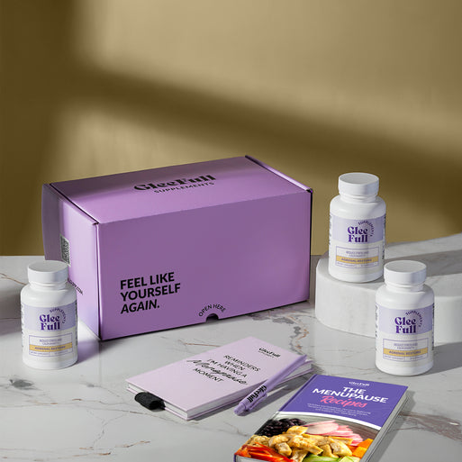 A hand holding a golden supplement capsule against a light gray background. Pink and purple headline text reads 'Calm Anxiety, Jitters & Overwhelm in 48 Hours.' A purple circular badge reads 'How to Use: Take 1 capsule morning or night to help recharge your adrenals.'
