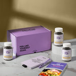 A product bundle display for GleeFull Supplements on a marble surface against a yellow background. The layout includes a large purple shipping box featuring the slogan 'FEEL LIKE YOURSELF AGAIN.', three white bottles of Calm & Balance, a purple branded pen, a matching notepad that reads 'REMINDERS WHEN I'M HAVING A MENOPAUSE MOMENT', and a recipe booklet titled 'THE MENOPAUSE Recipes'