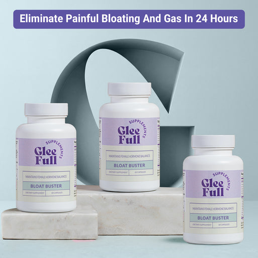 Three white GleeFull Bloat Buster bottles on marble blocks against a light blue-grey background. Purple banner reads: 'Eliminate Painful Bloating And Gas In 24 Hours'. Labels read 'Maintains Female Hormone Balance, Bloat Buster, 60 Capsules'.